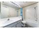 Bright bathroom featuring a bathtub and shower combo and vanity at 1740 Leaning Pine Way, Las Vegas, NV 89128