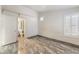 Comfortable bedroom featuring natural light and convenient access to the closet and bathroom at 1740 Leaning Pine Way, Las Vegas, NV 89128