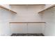 Bright closet with sturdy wooden rods for organization and efficient storage at 1740 Leaning Pine Way, Las Vegas, NV 89128