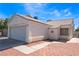 Inviting single-story home featuring a two-car garage, tiled roof, and beautiful desert landscaping at 1740 Leaning Pine Way, Las Vegas, NV 89128
