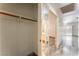Hallway with a view from the closet to the living space and bathroom at 1740 Leaning Pine Way, Las Vegas, NV 89128