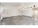 Bright and open living room with high ceilings, neutral walls, tile floors, and lots of natural light at 1740 Leaning Pine Way, Las Vegas, NV 89128