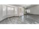 Spacious living room filled with natural light, featuring large windows and a fireplace, with marble floors at 1740 Leaning Pine Way, Las Vegas, NV 89128