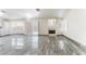 Spacious living room featuring a fireplace, tile flooring, and a seamless transition to the kitchen area at 1740 Leaning Pine Way, Las Vegas, NV 89128