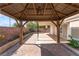 Beautiful view of backyard with brick paved patio and a wooden pergola perfect for entertaining at 1740 Leaning Pine Way, Las Vegas, NV 89128