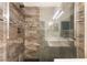 Close up view of marble shower featuring a glass enclosure and sleek design at 1740 Leaning Pine Way, Las Vegas, NV 89128