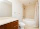Bright bathroom with a large tub-shower combination and wood vanity at 200 W Sahara Ave # 910, Las Vegas, NV 89102