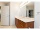 Bright bathroom with a large mirror and wooden vanity at 200 W Sahara Ave # 910, Las Vegas, NV 89102