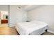 Bright bedroom with light-colored wood floors and a neutral color scheme, adjacent to a bathroom at 200 W Sahara Ave # 910, Las Vegas, NV 89102
