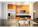 Elegant kitchen with stainless steel appliances, granite countertops, and wooden cabinets offering ample storage space at 200 W Sahara Ave # 910, Las Vegas, NV 89102