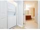 Bright laundry area, with a stackable washer and dryer located near bathroom at 200 W Sahara Ave # 910, Las Vegas, NV 89102