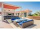 Outdoor rooftop deck featuring a bar, seating area with a fire pit and Strip views at 200 W Sahara Ave # 910, Las Vegas, NV 89102