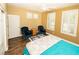 Spacious bedroom featuring wood floors, white shutters, and comfortable seating at 2106 King Mesa Dr, Henderson, NV 89012