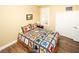 Comfortable bedroom with wood floors and white closet doors at 2106 King Mesa Dr, Henderson, NV 89012