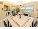 Bright dining room with tile flooring and access to the outdoor patio and pool at 2106 King Mesa Dr, Henderson, NV 89012