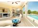 Inviting living area with pool view, built-in shelves and sliding doors at 2106 King Mesa Dr, Henderson, NV 89012