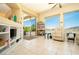 Bright living area with large windows, outdoor patio and pool access, and built-in shelves at 2106 King Mesa Dr, Henderson, NV 89012