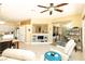 Living area showing the built in shelves, view of kitchen, and sliding doors to the patio at 2106 King Mesa Dr, Henderson, NV 89012