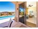 Seamless indoor-outdoor living with a view of the pool from the living room, perfect for entertaining guests at 2106 King Mesa Dr, Henderson, NV 89012