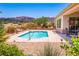 Inviting backyard pool with desert landscaping, and mountain views; perfect for outdoor relaxation at 2106 King Mesa Dr, Henderson, NV 89012