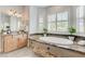 Relaxing bathroom with a soaking tub, granite countertops, and natural light at 2168 Big Bar Dr, Henderson, NV 89052