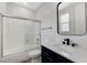Modern bathroom with a tub-shower combination, vanity, and contemporary fixtures at 2168 Big Bar Dr, Henderson, NV 89052