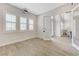 Spacious bedroom offers plenty of natural light, shutters, and seamless access to the living room at 2168 Big Bar Dr, Henderson, NV 89052