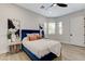Serene bedroom offering natural light, stylish decor, and wood-look floors for a cozy ambiance at 2168 Big Bar Dr, Henderson, NV 89052