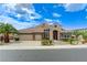 A beautiful single-Gathering home featuring a three-car garage and well-manicured landscaping at 2168 Big Bar Dr, Henderson, NV 89052