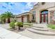 Inviting two-story home featuring a well-manicured lawn and a spacious three-car garage at 2168 Big Bar Dr, Henderson, NV 89052