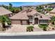 Attractive single-Gathering home with a spacious three-car garage, desert landscaping, and a tile roof at 2168 Big Bar Dr, Henderson, NV 89052