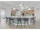 Bright, open kitchen featuring stainless steel appliances, pendant lighting, and a large island at 2168 Big Bar Dr, Henderson, NV 89052