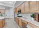 Modern kitchen featuring light wood cabinets, granite countertops, and stainless appliances at 2168 Big Bar Dr, Henderson, NV 89052