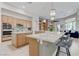 Spacious kitchen with granite countertops, center island, and stainless steel appliances at 2168 Big Bar Dr, Henderson, NV 89052