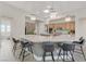 Bright, open kitchen featuring stainless steel appliances, pendant lighting, and a large island at 2168 Big Bar Dr, Henderson, NV 89052