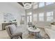 Bright living room featuring high ceilings, modern furnishings, and abundant natural light at 2168 Big Bar Dr, Henderson, NV 89052