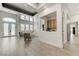 Stunning living area with high ceilings, stylish decor, and seamless flow to adjacent spaces at 2168 Big Bar Dr, Henderson, NV 89052