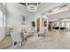 Spacious living room with high ceilings, modern lighting, and open floor plan to the kitchen and dining area at 2168 Big Bar Dr, Henderson, NV 89052