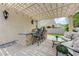 Covered pergola over outdoor kitchen and seating area at 2168 Big Bar Dr, Henderson, NV 89052