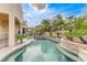 Enjoy a private backyard oasis with a sparkling pool, spa, covered patio, and desert landscaping at 2168 Big Bar Dr, Henderson, NV 89052