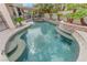 Relax in your private pool and spa surrounded by lush desert landscaping and serene privacy walls at 2168 Big Bar Dr, Henderson, NV 89052