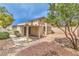 Enclosed backyard with patio area and low-maintenance landscaping at 2177 Hidden Ranch Ter, Henderson, NV 89052