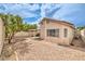 Cozy backyard featuring a covered patio and a rockscape, perfect for outdoor relaxation and entertaining at 2177 Hidden Ranch Ter, Henderson, NV 89052