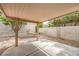 The backyard features a covered patio, rock landscaping, and block wall fence at 2177 Hidden Ranch Ter, Henderson, NV 89052