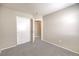 The bedroom features neutral carpet, neutral walls, a closet and door to another room at 2177 Hidden Ranch Ter, Henderson, NV 89052