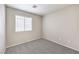 This bedroom features neutral walls, neutral carpet and a window with blinds at 2177 Hidden Ranch Ter, Henderson, NV 89052