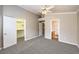 Bedroom boasts carpet, neutral walls, a walk-in closet, and an ensuite bathroom at 2177 Hidden Ranch Ter, Henderson, NV 89052
