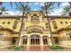 This luxurious casino boasts a grand entrance, tall palm trees, and an ornate facade for an impressive curb appeal at 2177 Hidden Ranch Ter, Henderson, NV 89052