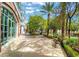 Inviting commercial space with outdoor benches, lush greenery, and shade trees along a paved walkway at 2177 Hidden Ranch Ter, Henderson, NV 89052
