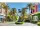 Beautifully landscaped community featuring palm trees, art installations, and well-maintained storefronts at 2177 Hidden Ranch Ter, Henderson, NV 89052